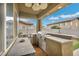 Well-equipped outdoor kitchen with a built-in grill and sink, perfect for entertaining by the pool at 2593 Indigo Cloud Ct, Las Vegas, NV 89142