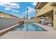 Luxurious swimming pool in a private backyard, complemented by a modern waterfall feature at 2593 Indigo Cloud Ct, Las Vegas, NV 89142