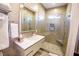 Contemporary bathroom featuring glass shower, sleek vanity, and neutral tile at 2793 Red Arrow Dr, Las Vegas, NV 89135