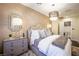 Elegant bedroom showcasing a decorative lamp, neutral colors, and modern decor at 2793 Red Arrow Dr, Las Vegas, NV 89135