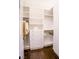 Walk in closet with custom shelving, drawers and hanging storage with hardwood flooring at 2793 Red Arrow Dr, Las Vegas, NV 89135