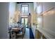 Lovely dining room with lots of light from a large window and french doors, decorated with a chandelier at 2793 Red Arrow Dr, Las Vegas, NV 89135