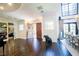 Expansive foyer featuring a piano, winding staircase, and decorative sculpture at 2793 Red Arrow Dr, Las Vegas, NV 89135