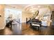 Open concept foyer with winding staircase, chandelier, and piano at 2793 Red Arrow Dr, Las Vegas, NV 89135