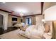 Serene main bedroom with a chandelier, fireplace, a sitting area, and access to the balcony at 2793 Red Arrow Dr, Las Vegas, NV 89135