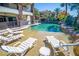 Lounge chairs surround the zero entry pool and spa on the property's pool deck at 2793 Red Arrow Dr, Las Vegas, NV 89135