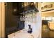 Close-up of a wine rack with glassware and marble countertop in a modern home at 2793 Red Arrow Dr, Las Vegas, NV 89135