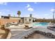 Inviting backyard with a refreshing pool, lounge seating and dining set - perfect for outdoor enjoyment at 2801 Emmons Ave, North Las Vegas, NV 89030