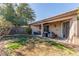 Backyard featuring covered patio with seating area and lush landscaping at 286 Fairmeadow St, Henderson, NV 89012