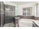 Modern walk-in shower and soaking tub with dark gray tile and window at 286 Fairmeadow St, Henderson, NV 89012