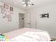 Bedroom with modern light fixture, patterned bedding, and wall decor at 286 Fairmeadow St, Henderson, NV 89012