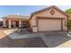 One-story house with a two-car garage and gravel driveway at 286 Fairmeadow St, Henderson, NV 89012