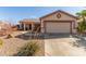 Single-story house with a two-car garage and desert landscaping at 286 Fairmeadow St, Henderson, NV 89012