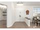 Elegant foyer with chandelier, double doors, and an eye catching dart board at 286 Fairmeadow St, Henderson, NV 89012
