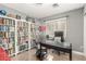 Home office with built-in bookcases and a large desk at 286 Fairmeadow St, Henderson, NV 89012