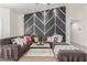 Stylish living room showcasing a decorative accent wall, plush sectional, and chic coffee table at 286 Fairmeadow St, Henderson, NV 89012