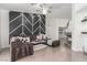 Stylish living room boasts decorative accent wall, plush sofa, and modern lighting at 286 Fairmeadow St, Henderson, NV 89012