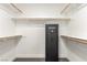 Walk-in closet with built-in shelving, wood racks and Nevada Safe at 286 Fairmeadow St, Henderson, NV 89012