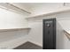 Walk-in closet featuring built-in shelving, wood racks and Nevada Safe at 286 Fairmeadow St, Henderson, NV 89012