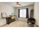 Spare bedroom featuring a ceiling fan, carpeted floors, and a window for natural light at 3353 Kylemore St # 101, Las Vegas, NV 89129