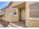 Inviting front porch featuring tile flooring and neutral stucco exterior at 3353 Kylemore St # 101, Las Vegas, NV 89129