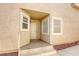 Inviting front porch featuring tile flooring and neutral stucco exterior at 3353 Kylemore St # 101, Las Vegas, NV 89129