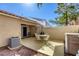 View of the private outdoor patio featuring outdoor seating and white sun umbrella at 3353 Kylemore St # 101, Las Vegas, NV 89129