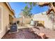 This private outdoor patio features a seating area with a sun umbrella at 3353 Kylemore St # 101, Las Vegas, NV 89129