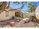 Private outdoor patio featuring stone and gravel landscaping and outdoor seating at 3353 Kylemore St # 101, Las Vegas, NV 89129