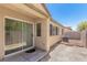 View of backyard with patio and sliding glass door at 3357 Sheep Canyon St, Las Vegas, NV 89122