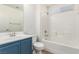 Clean bathroom, blue vanity, and a shower/tub combo at 3357 Sheep Canyon St, Las Vegas, NV 89122