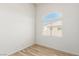 Bright bedroom with wood-look floors and a window with blinds at 3357 Sheep Canyon St, Las Vegas, NV 89122