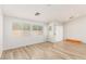 Bright living room with light wood floors and large windows at 3357 Sheep Canyon St, Las Vegas, NV 89122