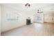 Bright living room featuring a fireplace, ceiling fan, and wood-look floors at 353 Keating St, Henderson, NV 89074