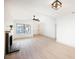 Bright living room featuring a fireplace, ceiling fan, and wood-look floors at 353 Keating St, Henderson, NV 89074