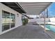 Covered patio overlooking a sparkling pool, surrounded by a white brick fence at 3700 San Angelo Ave, Las Vegas, NV 89102