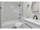 Modern bathroom boasts white marble-style tile, a sleek vanity, and updated fixtures at 3700 San Angelo Ave, Las Vegas, NV 89102