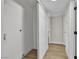 Hallway with neutral paint and baseboards plus ample closet and storage space at 3700 San Angelo Ave, Las Vegas, NV 89102