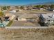 This tan single story home features desert landscaping and a tile roof at 3714 Mount Charleston Dr, Pahrump, NV 89048