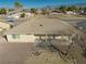 This tan single story home features a covered patio, desert landscaping, and tile roof at 3714 Mount Charleston Dr, Pahrump, NV 89048