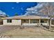 Back exterior of home with covered patio at 3714 Mount Charleston Dr, Pahrump, NV 89048