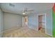 Spacious bedroom features neutral carpet, ceiling fan, walk-in closet and gray colored accent wall at 3714 Mount Charleston Dr, Pahrump, NV 89048