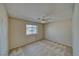 Neutral bedroom features carpeted floors, a ceiling fan, and a window with mountain views at 3714 Mount Charleston Dr, Pahrump, NV 89048