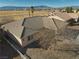 Tan single story home with gravel landscaping and tile roof under a bright blue sky at 3714 Mount Charleston Dr, Pahrump, NV 89048