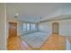 Bright living room with a ceiling fan, large windows, and seamless flooring at 3714 Mount Charleston Dr, Pahrump, NV 89048