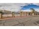 Community pool surrounded by a wrought iron fence in a residential complex at 3932 Voxna St, Las Vegas, NV 89119