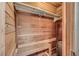 Cozy wooden sauna with a built-in bench and heating unit, offering a private relaxation space at 3932 Voxna St, Las Vegas, NV 89119