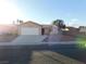 One-story house with a white garage door and desert landscaping at 4225 Seth Dr, North Las Vegas, NV 89032