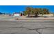 Street view of home featuring a large lot with mature landscaping at 4424 Shady Hollow Ave, North Las Vegas, NV 89031