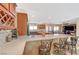 Kitchen bar with seating and view of adjacent dining area and comfortable living room at 4424 Shady Hollow Ave, North Las Vegas, NV 89031